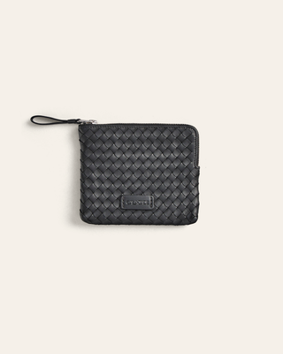 Black woven zippered pouch on a light gray background