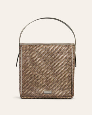 Cala Jade Iwa Woven handbag with a leather handle on a light gray background