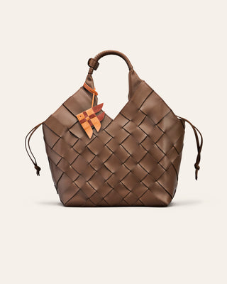 Cala Jade Misu Large - Brown woven handbag with a bag charm on a light beige background