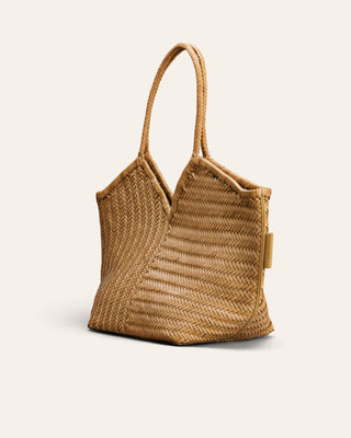 A natural woven straw tote bag with a V-shaped top and double shoulder straps, shown against a solid off-white background.