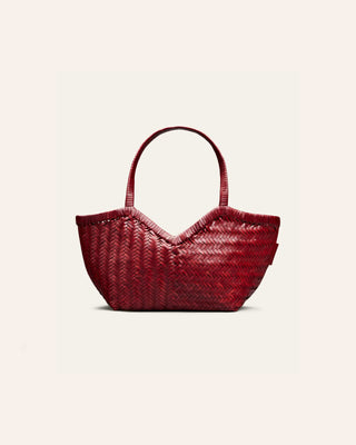 Cala Jade Humi S woven shoulder bag in warm red on a beige background
