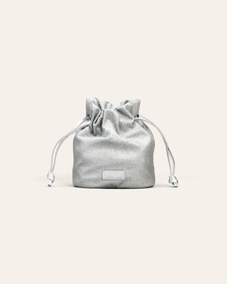 Silver drawstring pouch on a light beige background