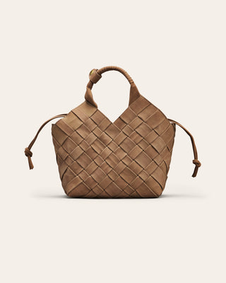 Brown nubuck leather woven handbag on a light beige background