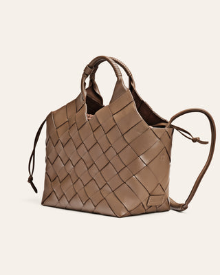 Brown woven handbag on a light beige background
