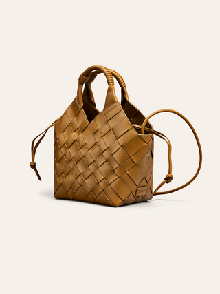 Cala Jade Misu Sepia Brown leather bag on a beige background
