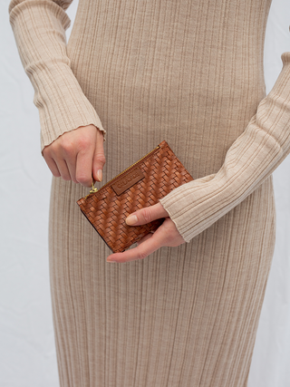 Cala Jade Caia leather wallet close up image on a model