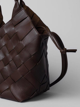 Cala Jade Misu L Umber shoulder bag close up image on a beige background