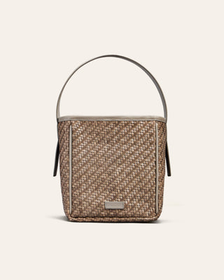 Cala Jade beige woven bucket bag with a visible brand label on a beige background