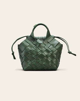 Cala Jade Green woven handbag on a light gray background with a green cotton innerbag