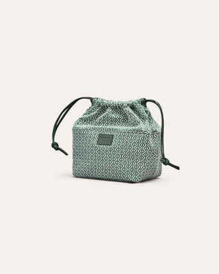 Cala Jade green cotton innerbag on a beige background