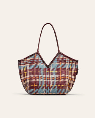 Tartan patterned handbag on a beige background