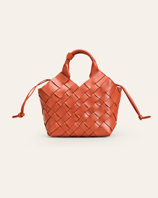 A brown handbraided MISU shoulder bag with a shoulder strap and a zipper closure.