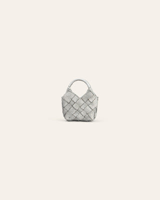 silver woven handbag charm on a light gray background