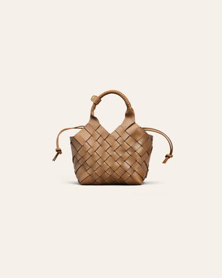 A light brown woven leather handbag on a beige background