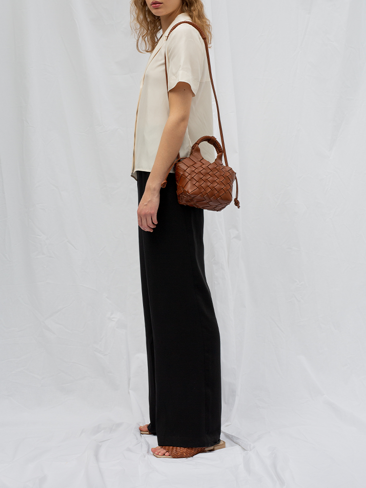 Cala Jade brown cross-body bag on model
