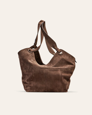 Cala Jade Brown leather handbag on a light beige background