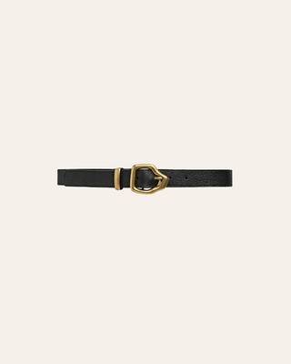 Black belt with a gold buckle on a beige background