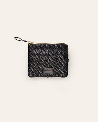 Cala Jade small black leather pouch on a beige background