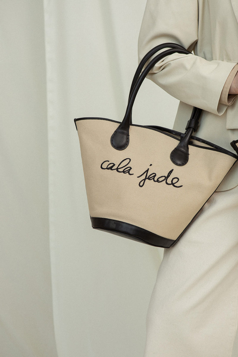 Cala Jade Sandhi beige canvs tote bag on model