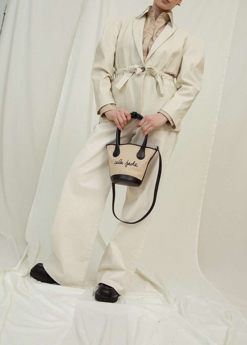 Cala Jade Sandhi beige canvas tote bag on model