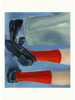 Black shoes with red socks on a blue background